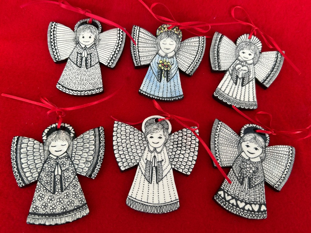 Ceramic angel ornaments with handpainted black and white designs