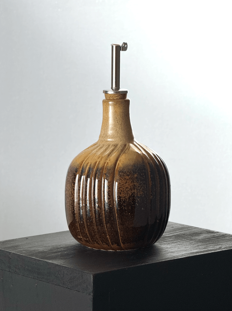 Oil cruet with warm brown and caramel glazes