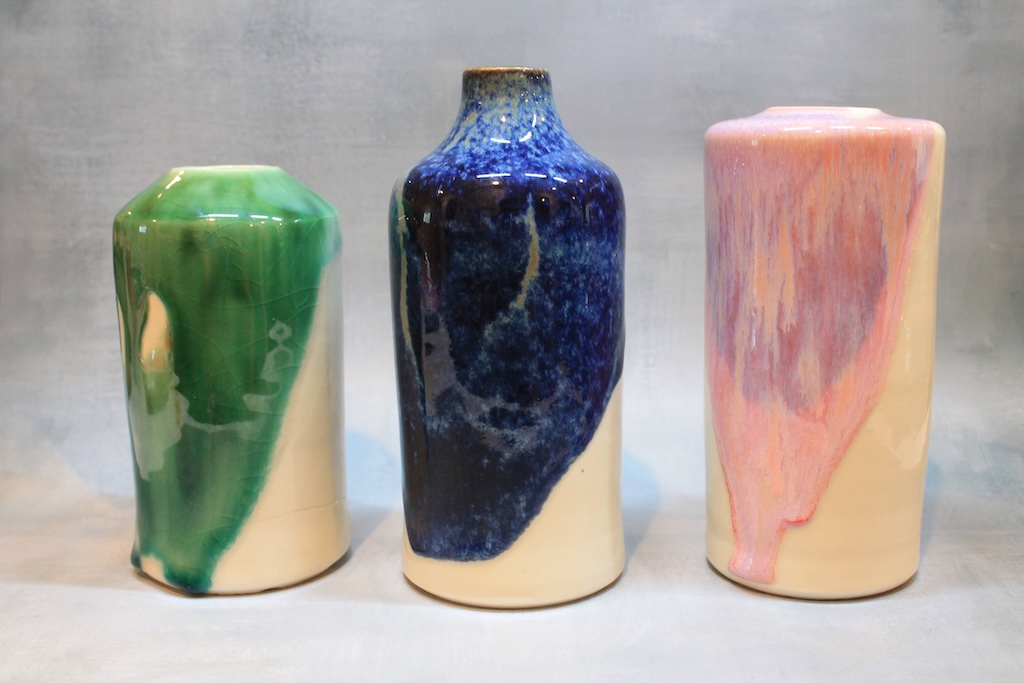 3 vases with glazes in green, blue, and pink