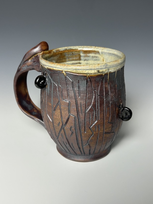 Brown carved ceramic mug