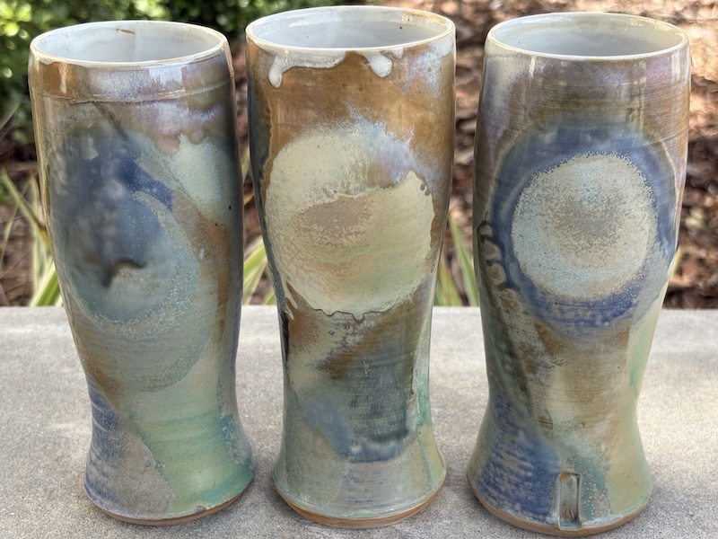 3 ceramic tumblers with blue and brown glazes