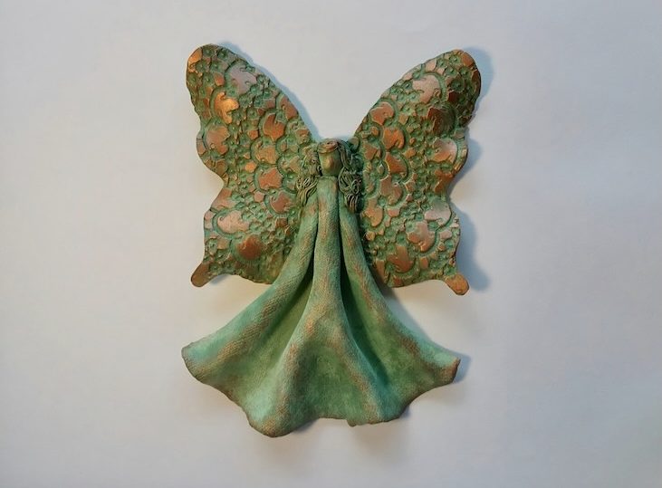 Red clay textured angel with green copper glaze