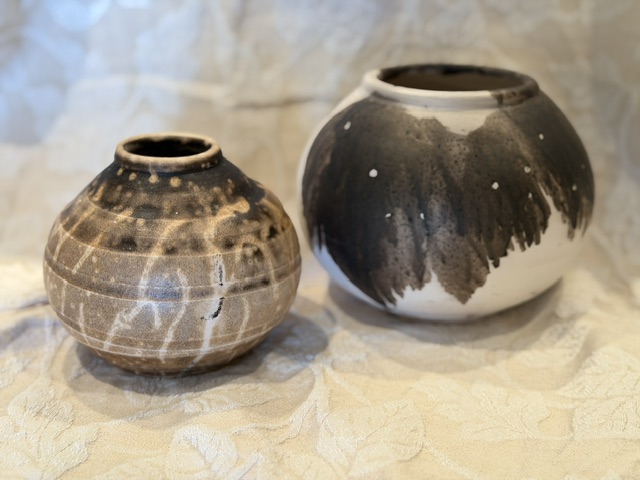 2 raku spherical vases