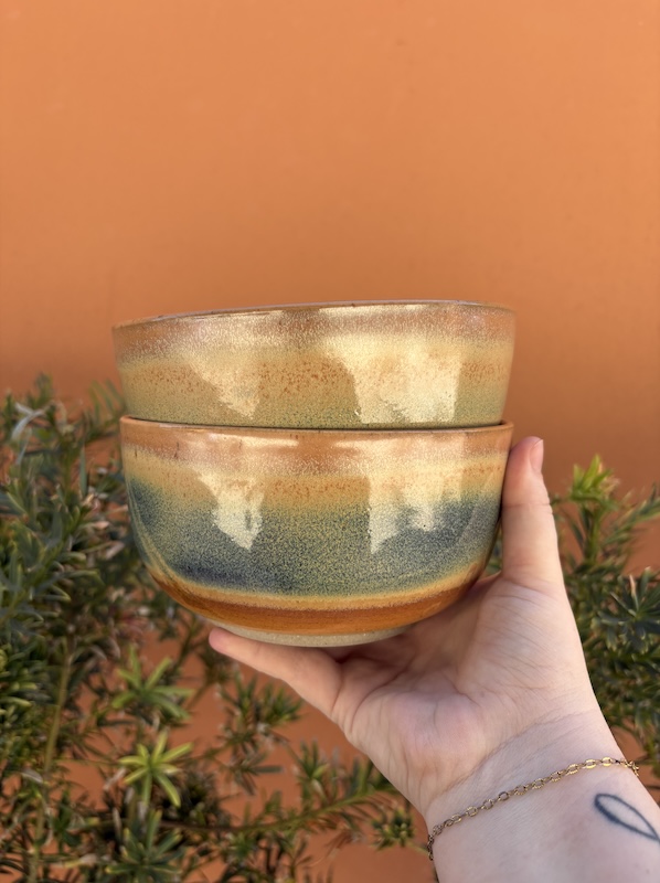 @ stacked bowls with orange and blue glaze