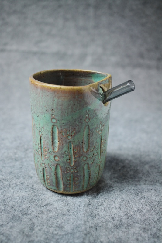 Cup with straw and Light copper green glaze
