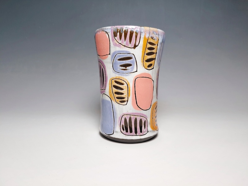 Colorful tall cup with carving